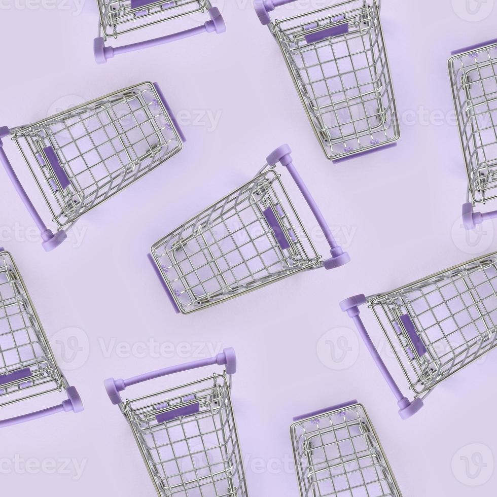 Pattern of many small shopping carts on a violet background. Minimalism flat lay top view photo