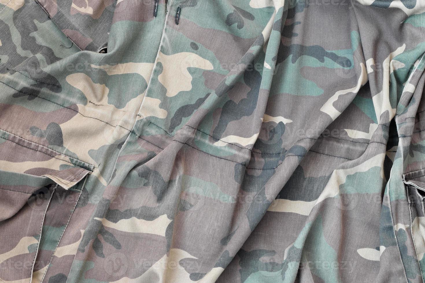 Camouflage background texture as backdrop for hunting or fishing design projects photo