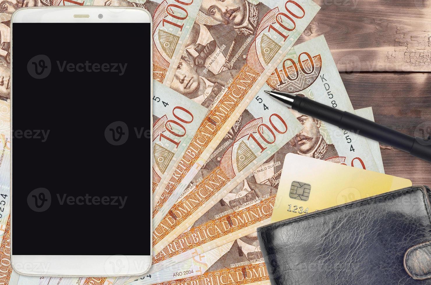 100 Dominican peso bills and smartphone with purse and credit card. E-payments or e-commerce concept. Online shopping and business with portable devices photo
