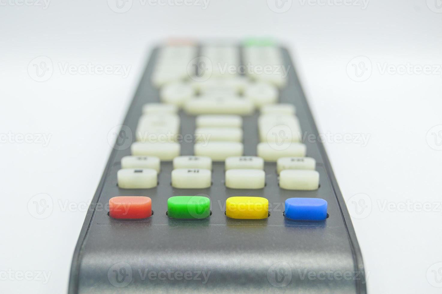 The bottom view of the remote control has four colored buttons. photo
