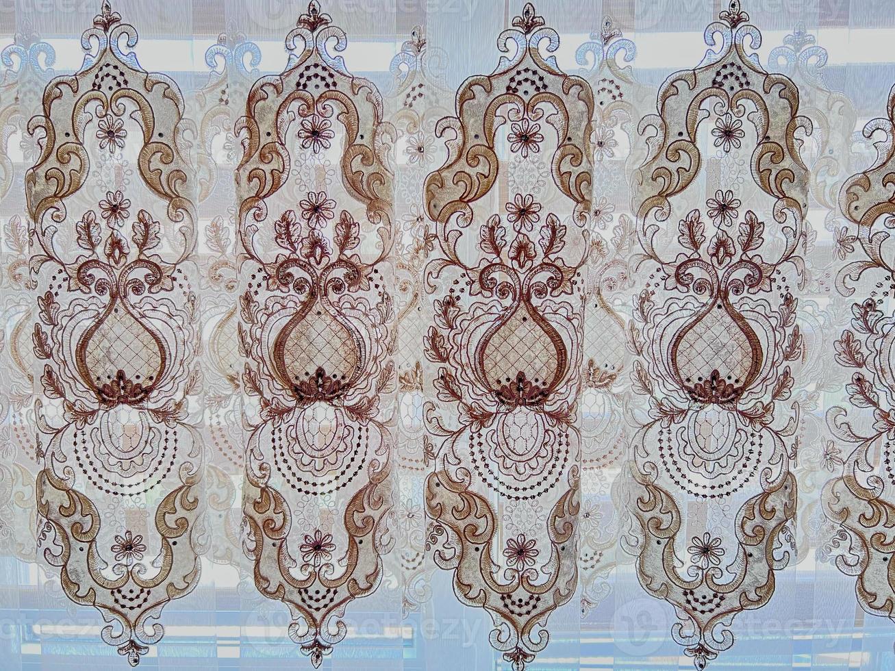 Abstract symmetrical pattern on the curtain. photo