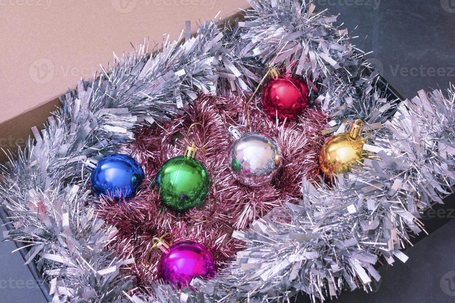 A set of Christmas decorations and burlap in a box photo