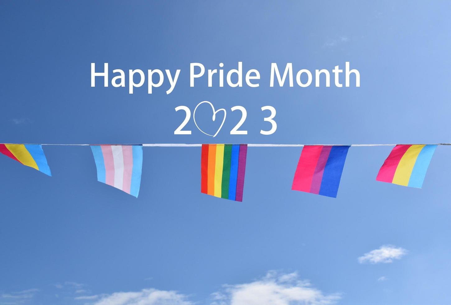 Drawing of rainbow colours with texts 'Happy Pride Month 2023', concept for LGBTQAI community celebrations in pride month around the world. photo