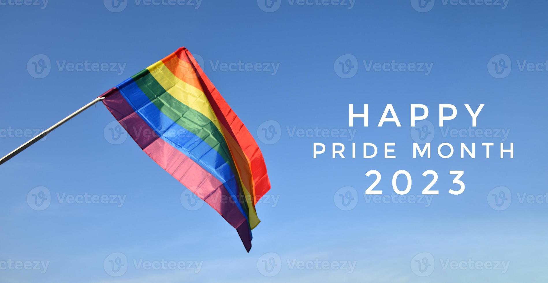 Drawing of rainbow colours with texts 'Happy Pride Month 2023', concept for LGBTQAI community celebrations in pride month around the world. photo