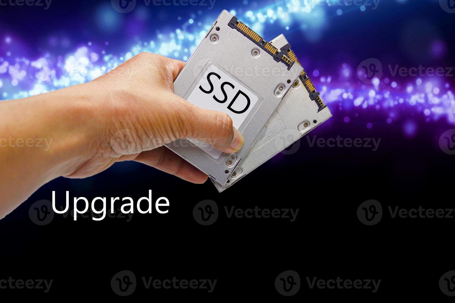 SSD hard drive, hand holding SSD photo