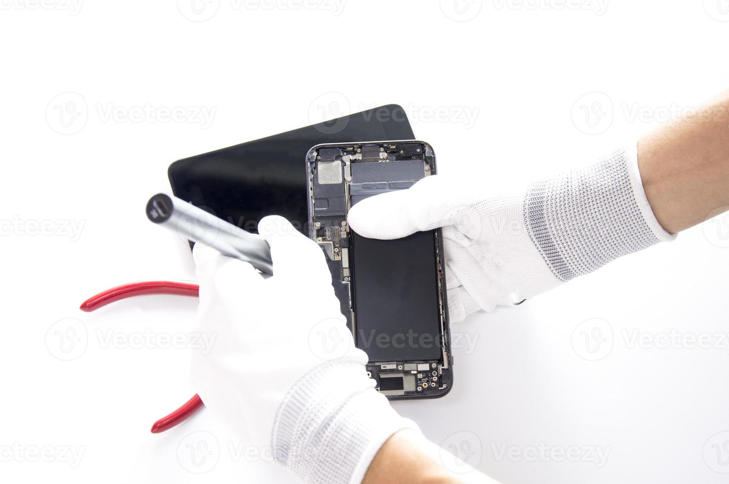 top view, technician fixing a smartphone photo