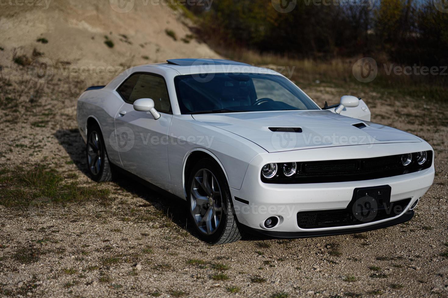 White powerfull american muscle car in career. photo