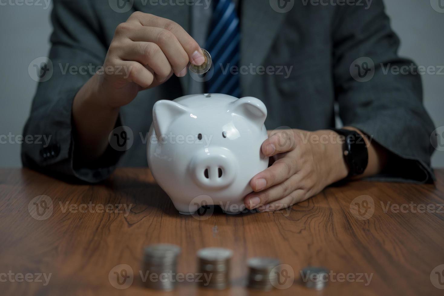 Man hand holding piggy bank, saving money wealth and financial concept, Business, finance, investment, Financial planning. photo