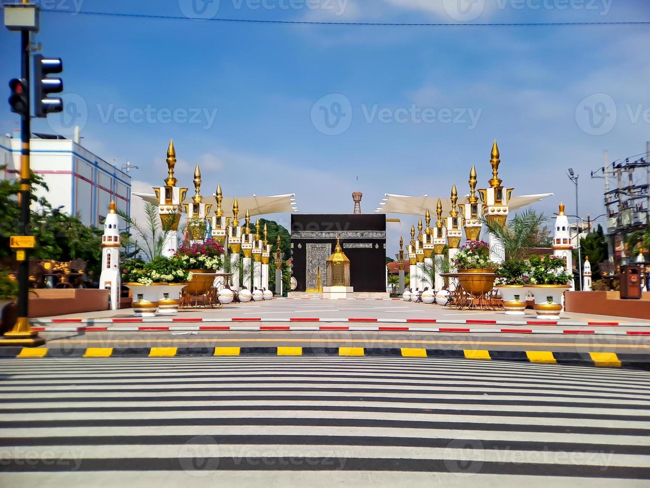 Replica of the Mecca Kaaba in the city of Madiun, East Java, Indonesia, with a beautiful clear blue sky. photo