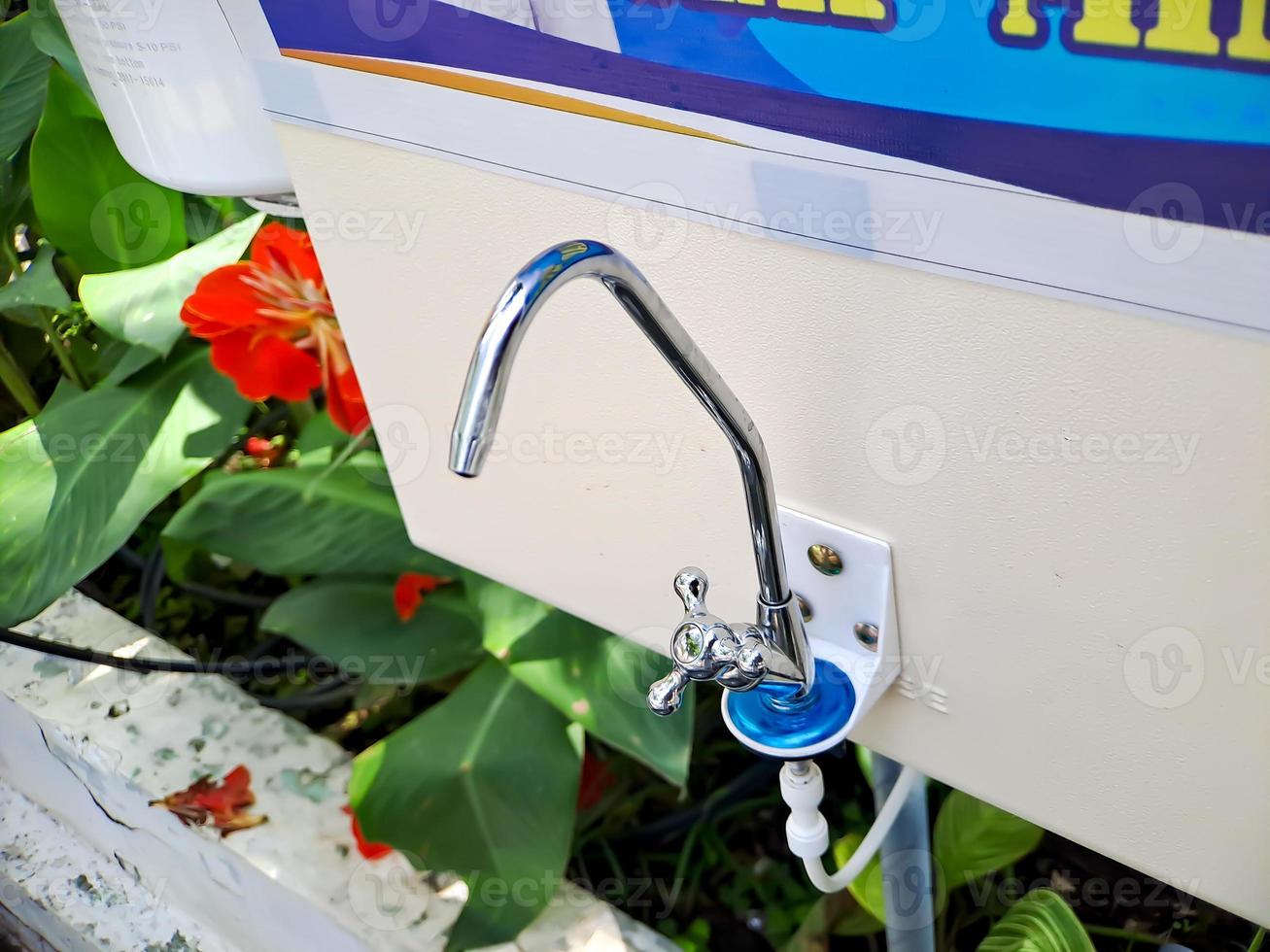 water faucet made of metal in a public park. photo