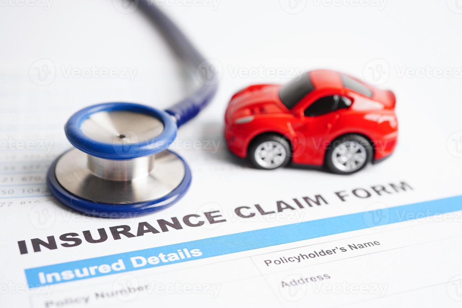 Stethoscope on Insurance claim accident car form, Car loan, insurance and leasing time concepts. photo