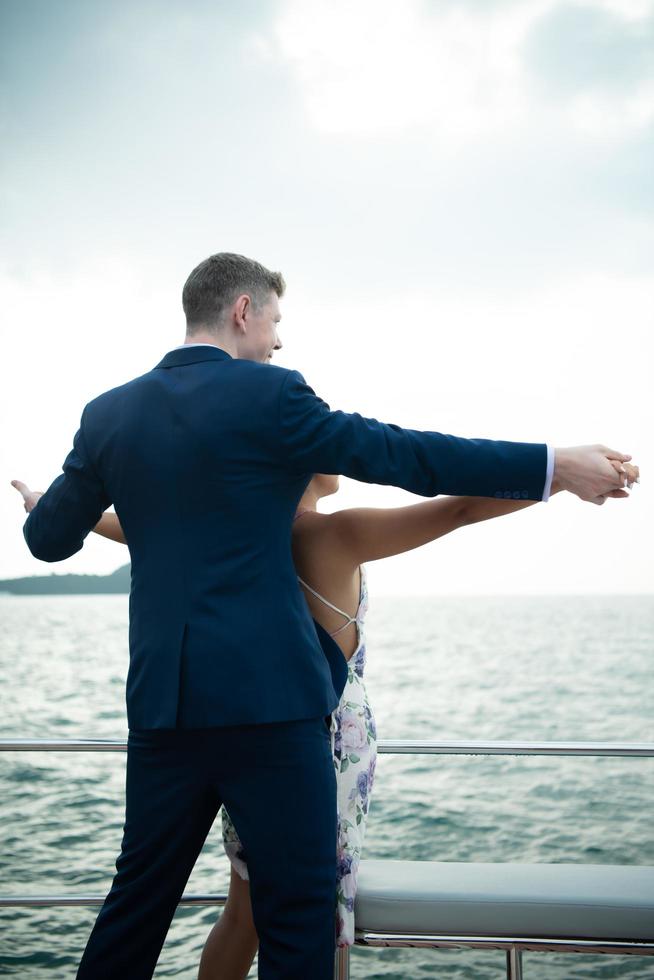 Happy moments of interracial couples on a yacht The couple had their honeymoon at one of Asia's photo