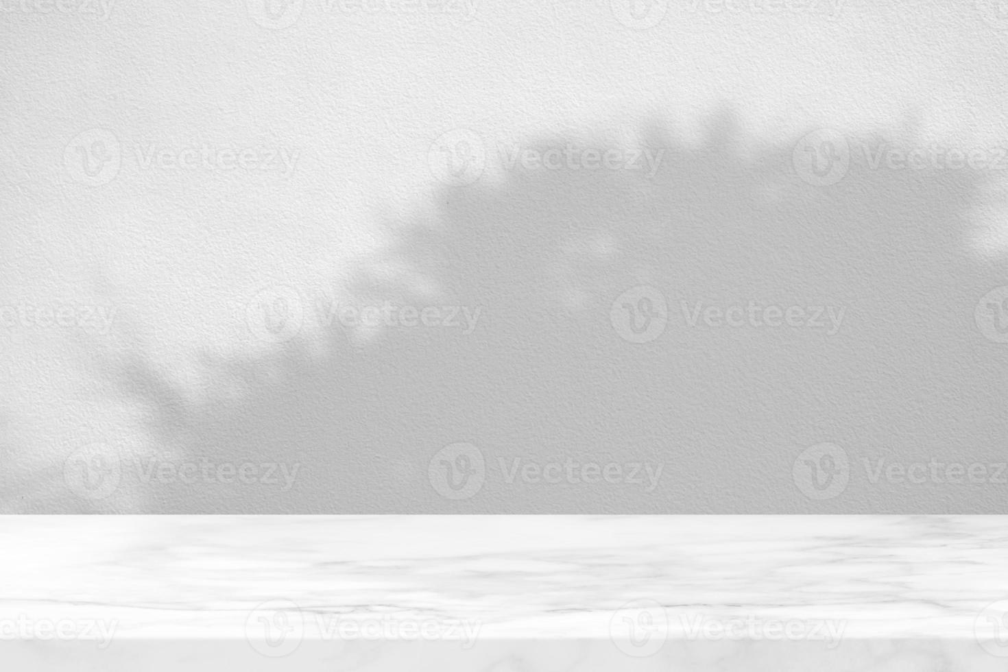 Marble Table with Bamboo Bush Shadow on Stucco Wall Texture Background, Suitable for Product Presentation Backdrop, Display, and Mock up. photo