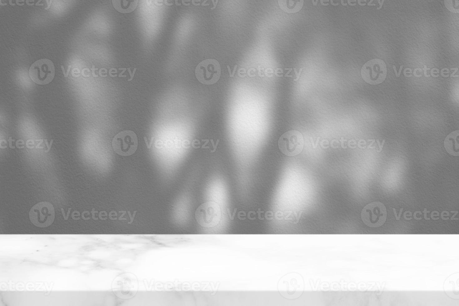 White Marble Table with Garden Shadow on Concrete Wall Texture Background, Suitable for Product Presentation Backdrop, Display, and Mock up. photo