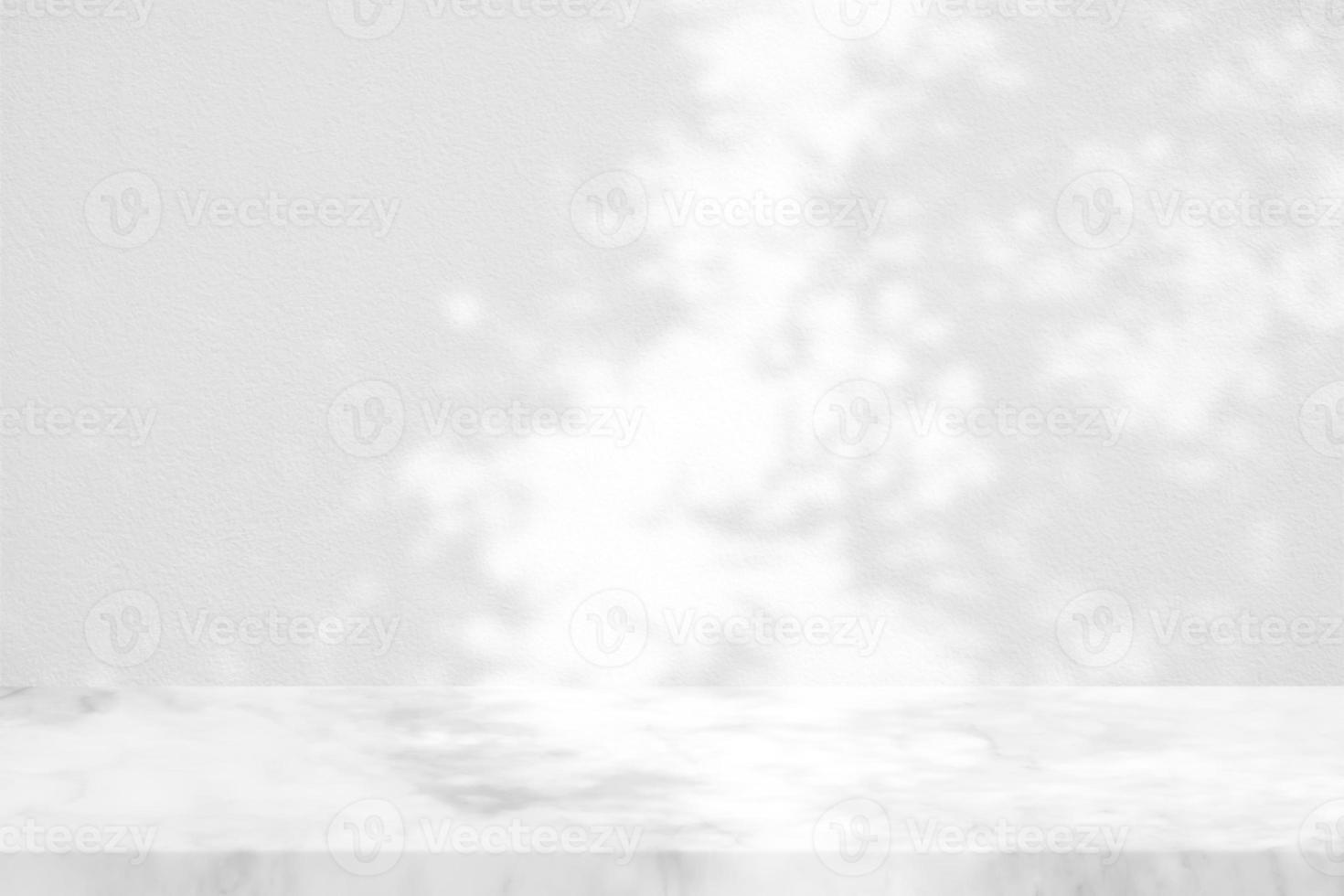 White Marble Table with Bamboo Leaves Shadow on Concrete Wall Texture Background, Suitable for Product Presentation Backdrop, Display, and Mock up. photo