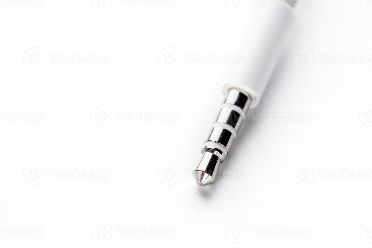 Isolated white aux cable on white background photo