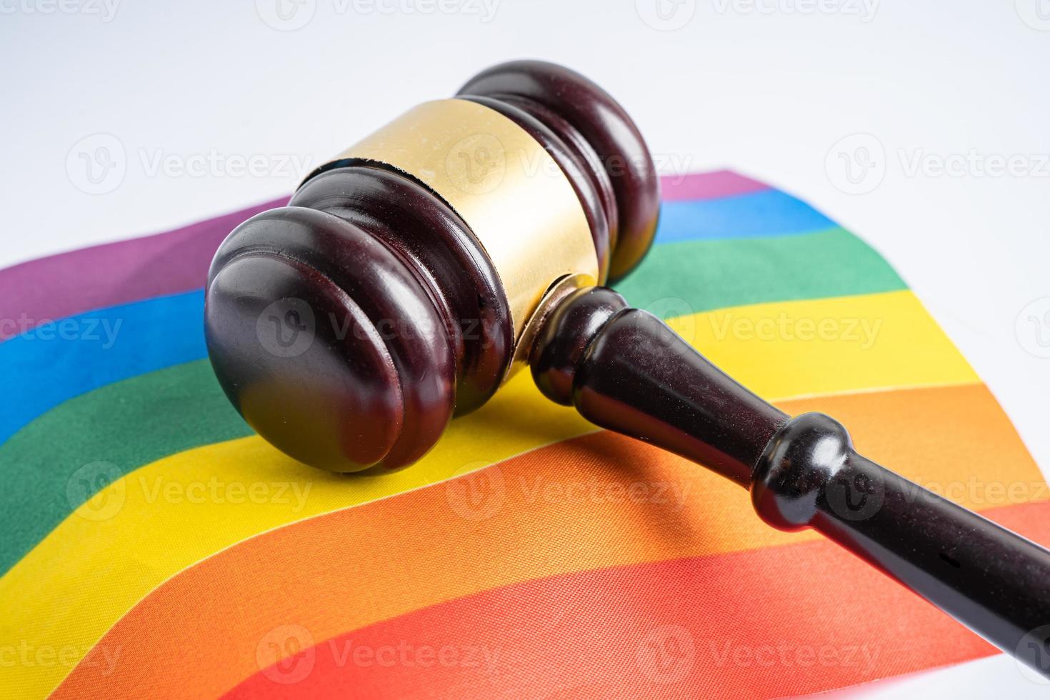 Gavel for judge lawyer on rainbow flag, symbol of LGBT pride month celebrate annual in June social of gay, lesbian, bisexual photo