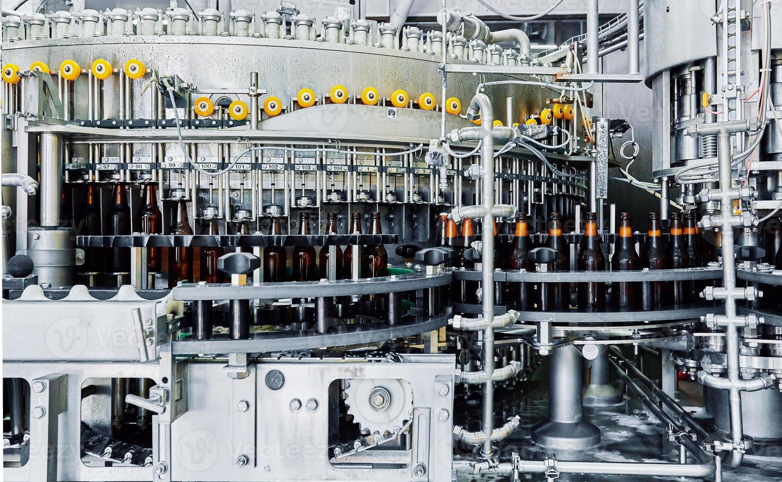 Industrial machinery for bottling process photo