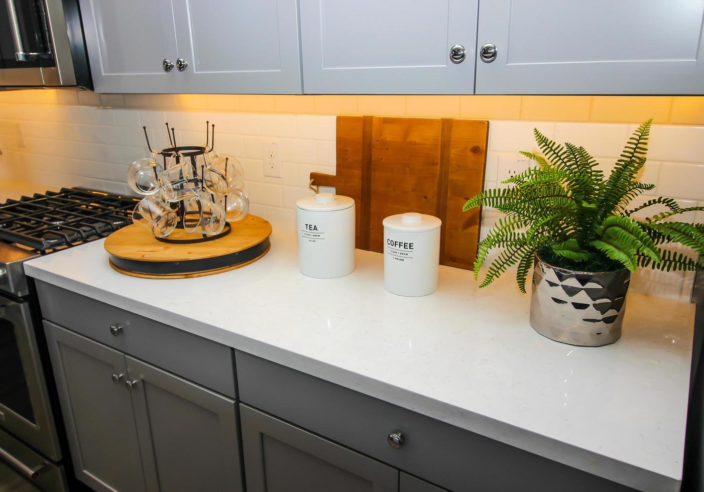 Kitchen Counter Top With Lazy Susan Of Glass Coffee Mugs photo