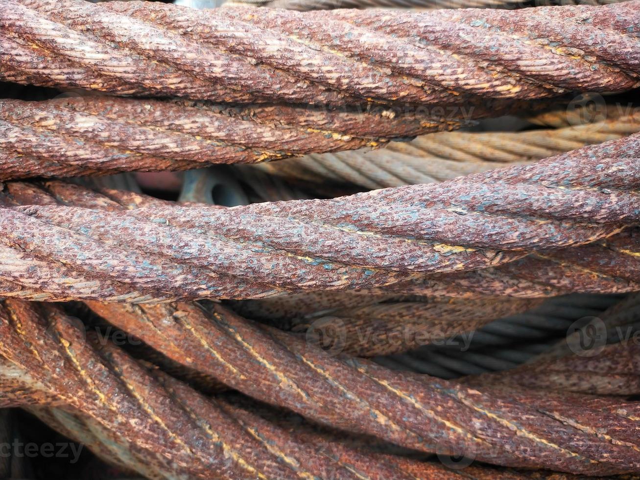Selective focus of a pile of rusty wire slings. photo