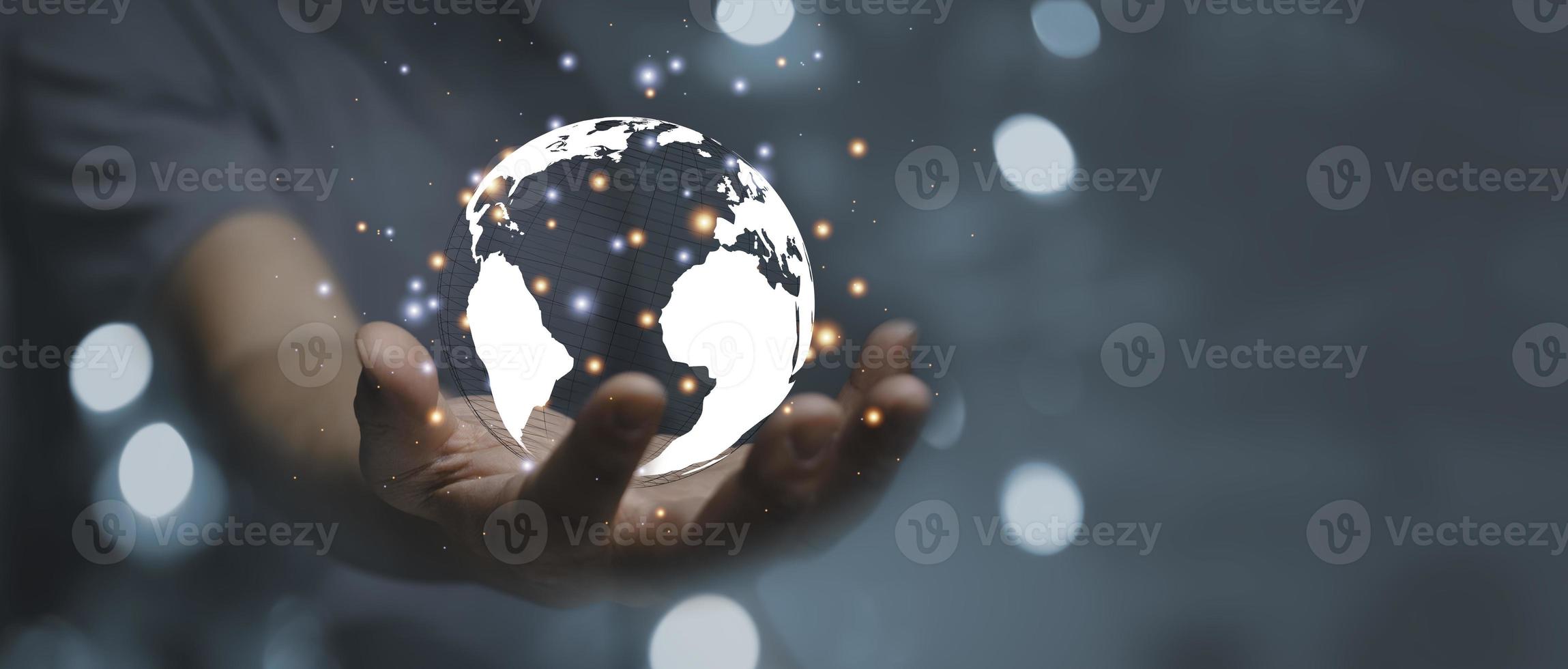 Businessman holding Global network connection. Big data analytics and business intelligence concept. World map point and line composition concept of global business. Digital link technology. photo