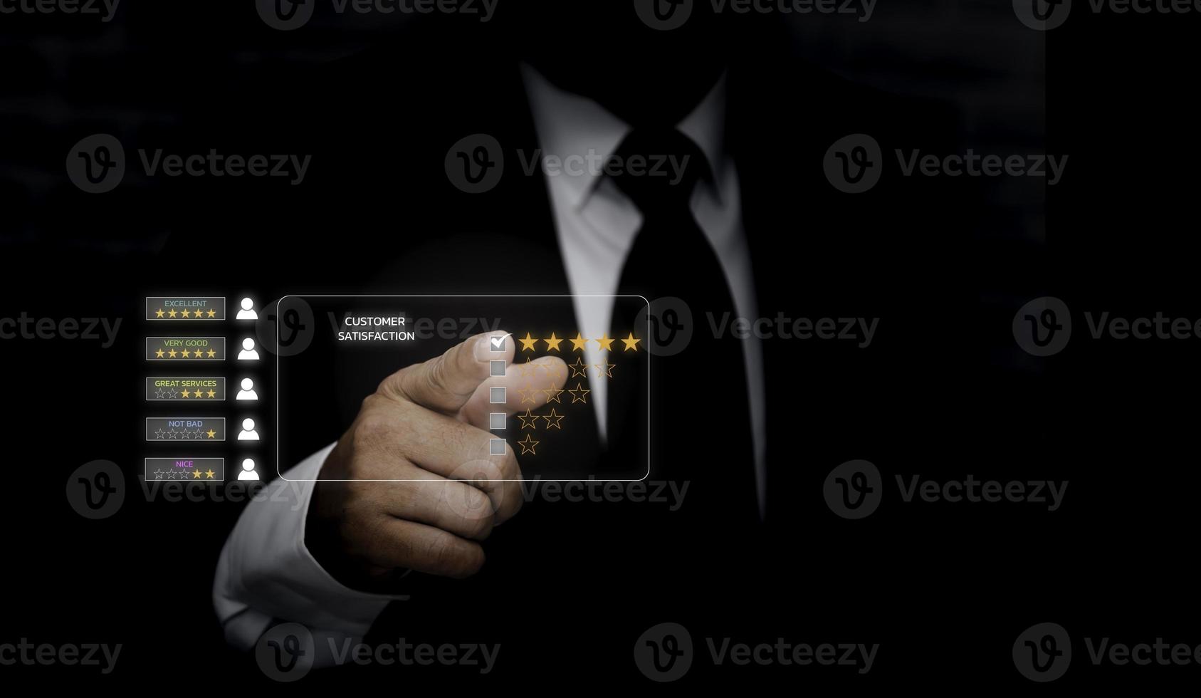 Customer service and Satisfaction concept ,Business people are touching the virtual screen on the happy Smiley face icon to give satisfaction in service. rating very impressed. photo