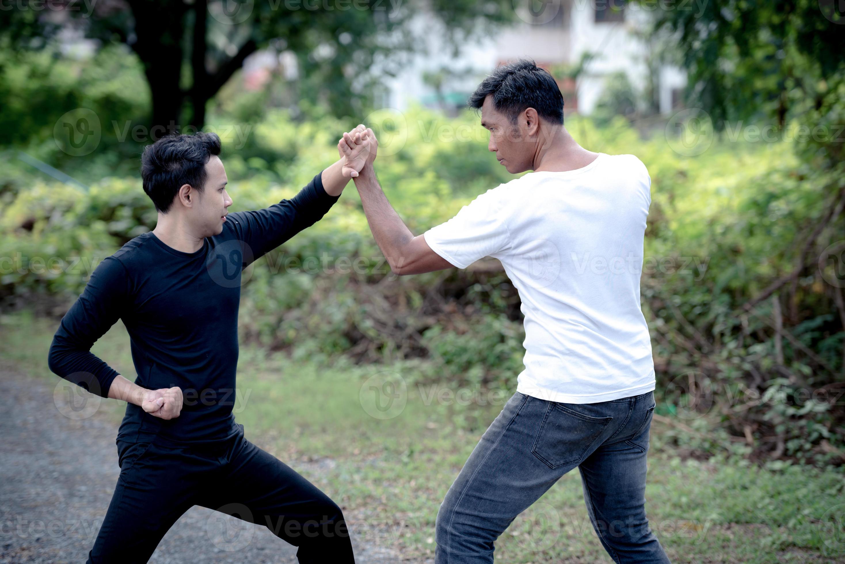 Young man training self defense fighting technique. 14325193 Stock