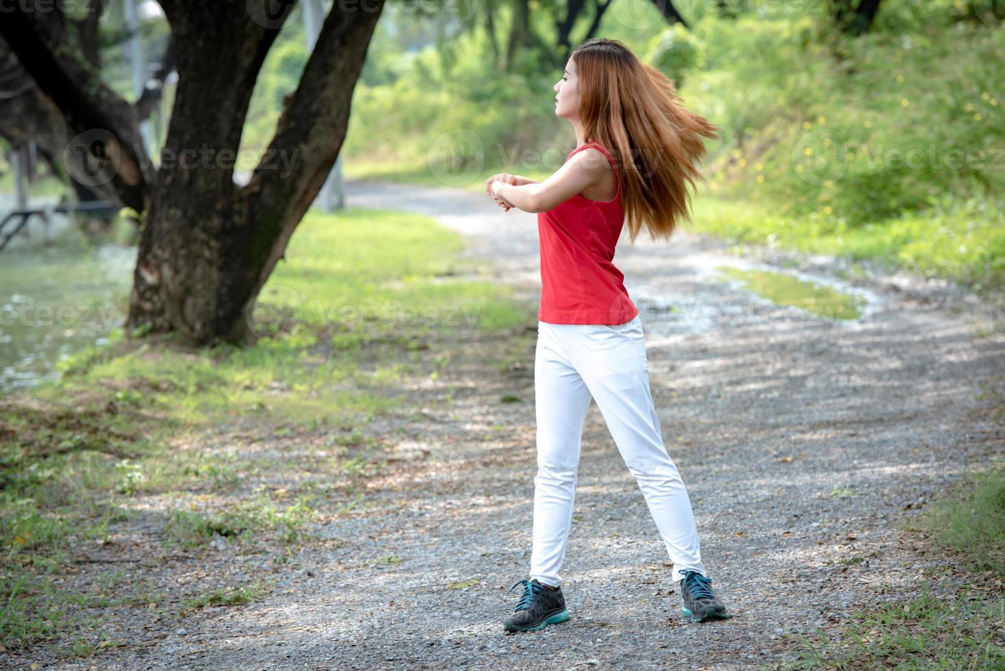 Young Asian healthy woman exercise in the park. photo