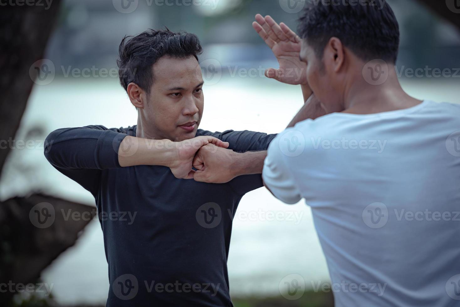 Young man training self defense fighting technique. 14325197 Stock