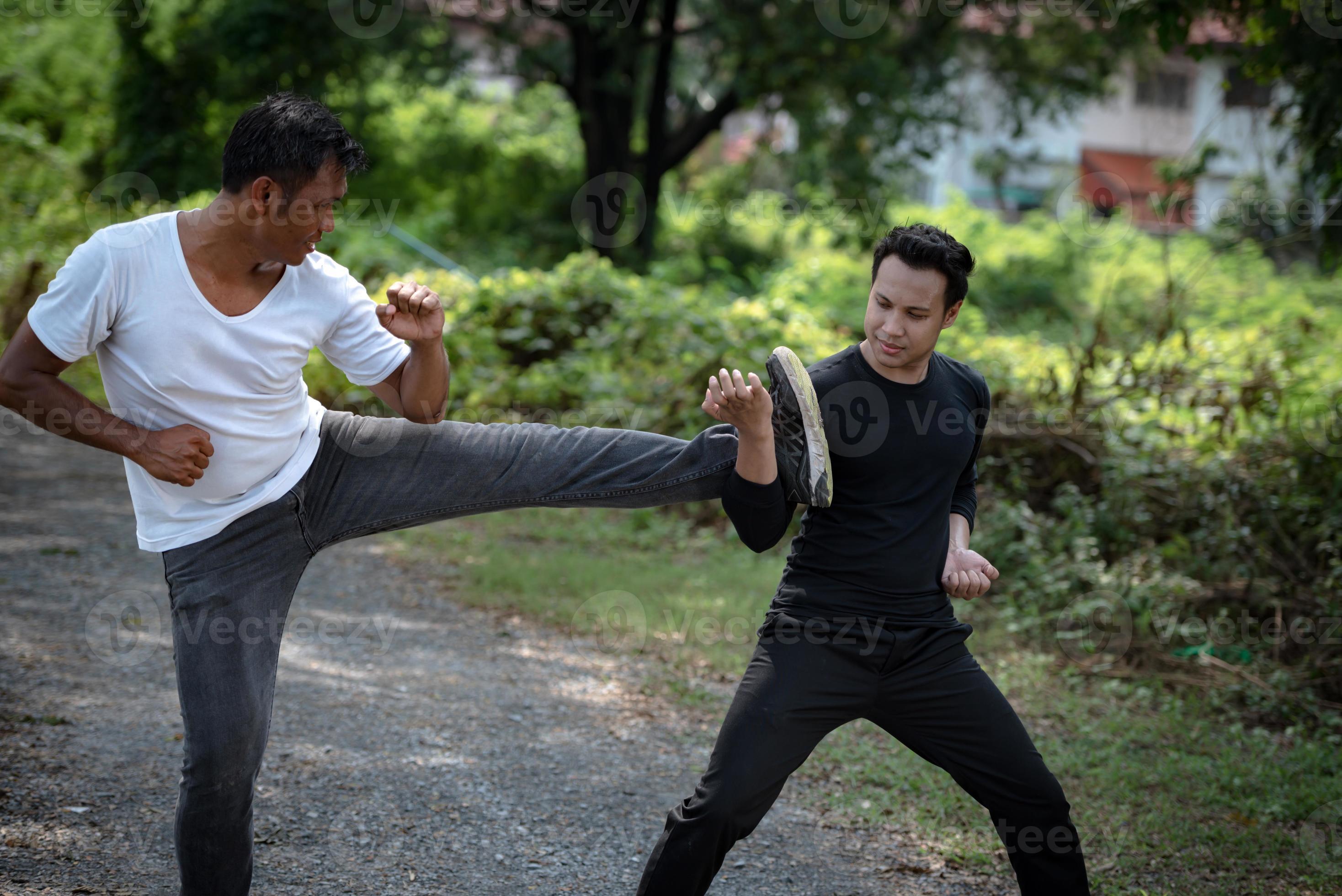 Young man training self defense fighting technique. 14325199 Stock