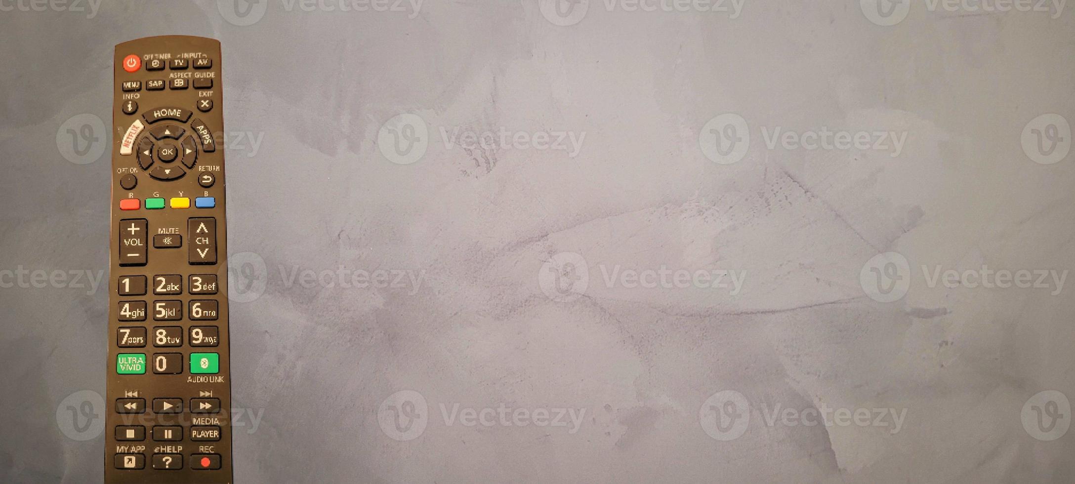 TV remote control with dark background 14325887 Stock Photo at Vecteezy