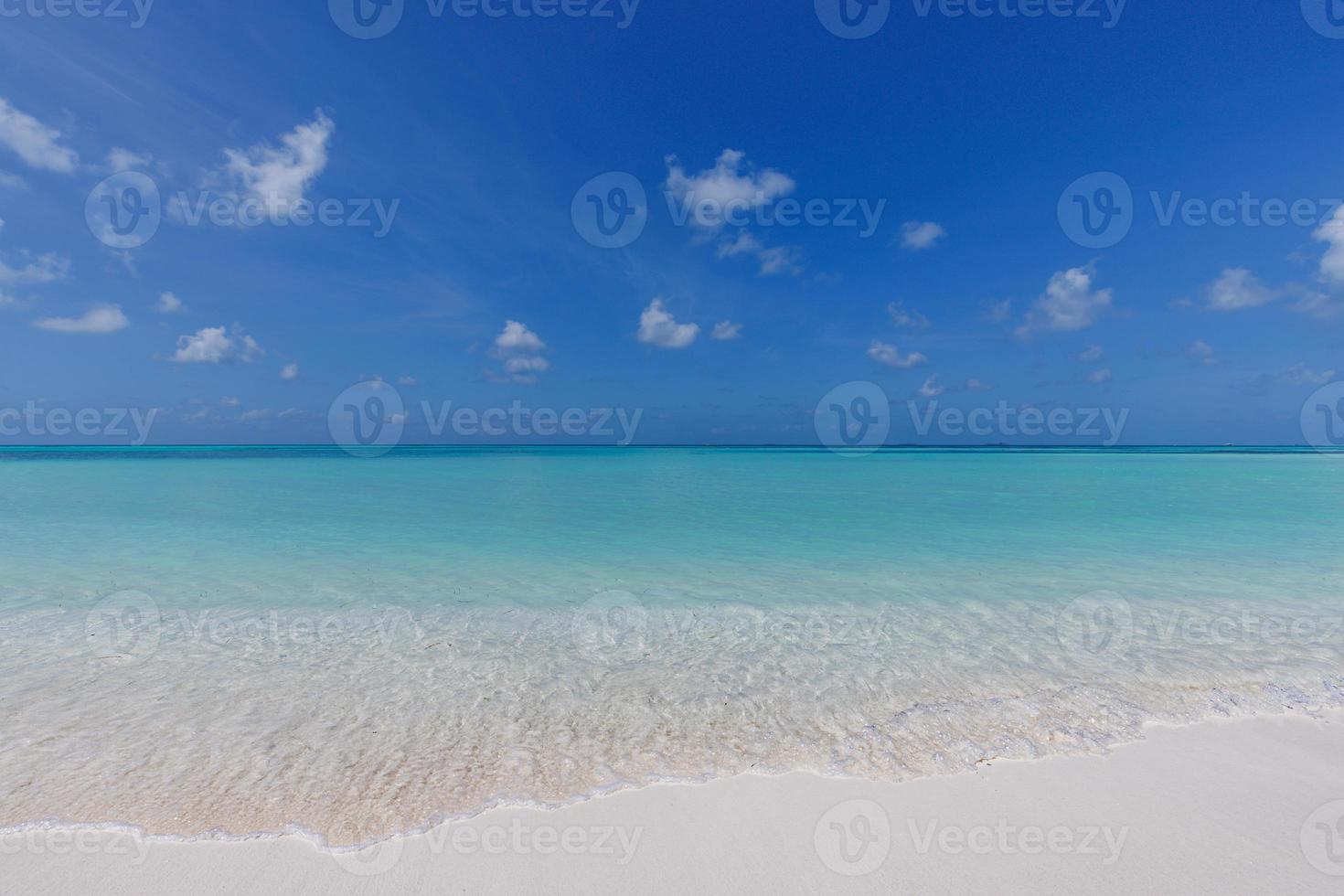 Summer seascape beautiful waves, blue sea water in sunny day. Top view from drone. Sea aerial view, amazing tropical nature background. Beautiful bright sea waves splashing and beach sand sunset light photo