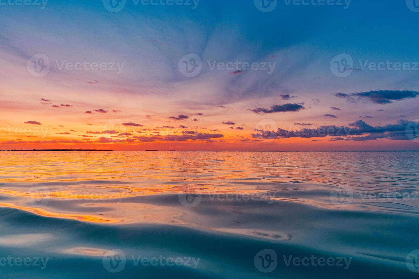 Beautiful sunset ocean water surface. Tranquil summer meditation relaxing seascape. Exotic sunrise beach sun rays, sea and horizon. Amazing nature view, waves colorful sky. Majestic beach coast shore photo