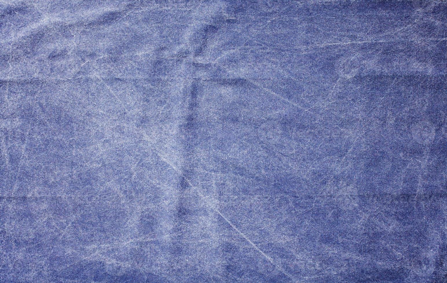 Smooth blue rough fabric texture top view. photo