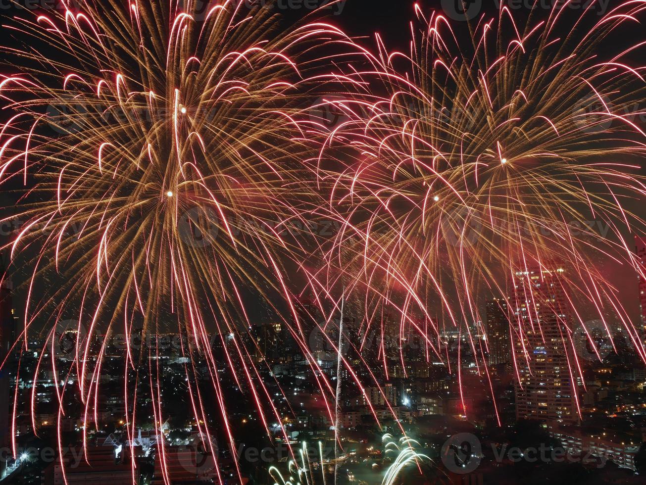 High angle view Fantastic Multicolor Long Exposure shot of Fireworks over Chao Phraya River, Cityscape of Bangkok, Festival, Celebration, Happy New Year, Business Architecture. photo