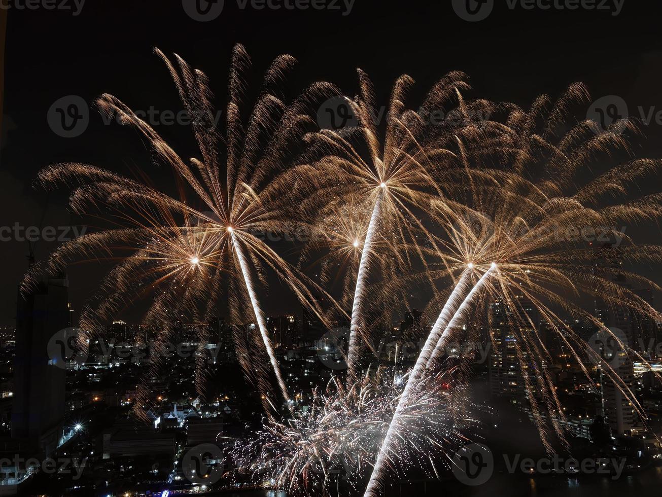 High angle view Fantastic Multicolor Long Exposure shot of Fireworks over Chao Phraya River, Cityscape of Bangkok, Festival, Celebration, Happy New Year, Business Architecture. photo