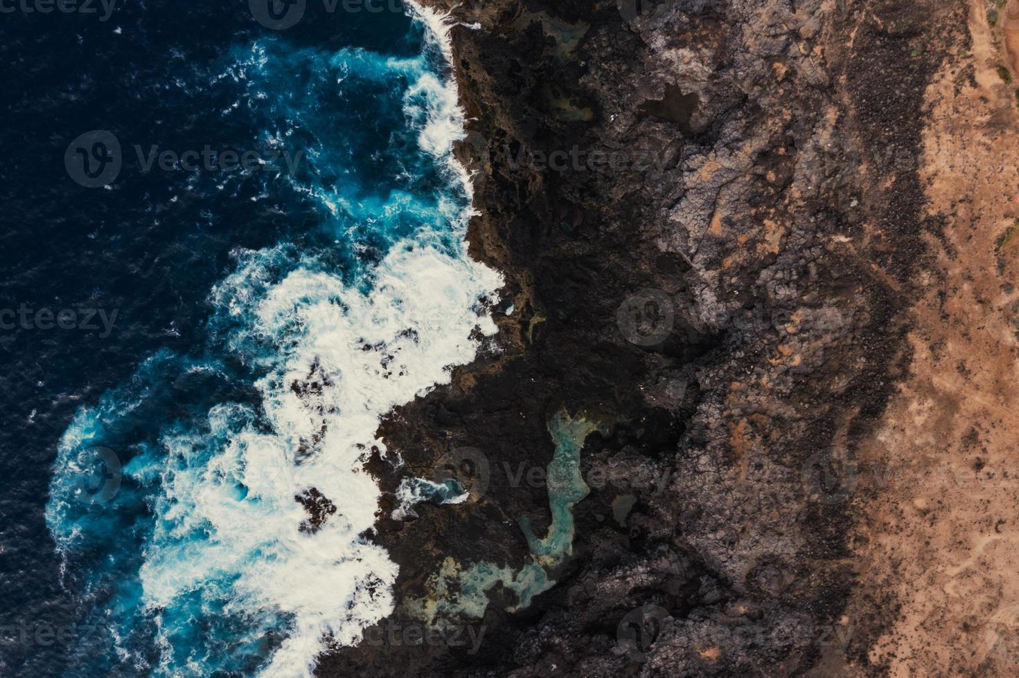Sea waves breaking in the coast photo