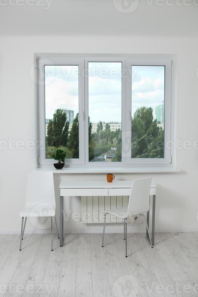 Window in an empty new apartment without curtains photo