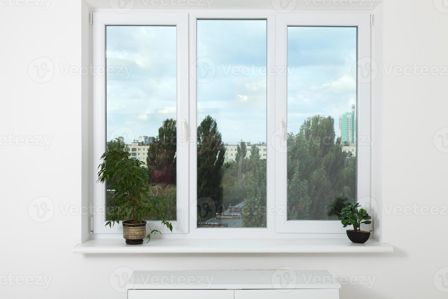 Window in an empty new apartment without curtains photo