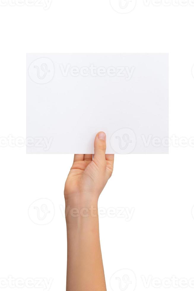 Hand holding blank flyer, sheet of paper in horizontal position with isolated background photo