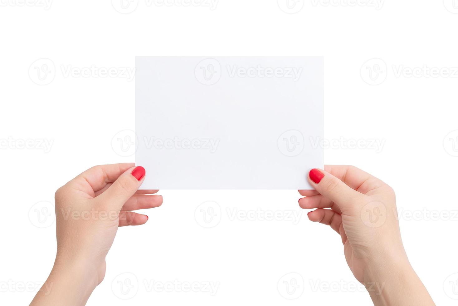 White A6 paper in woman's hands. Horizontal position. Blank sheet for copy presentation. Isolated bacgkround photo