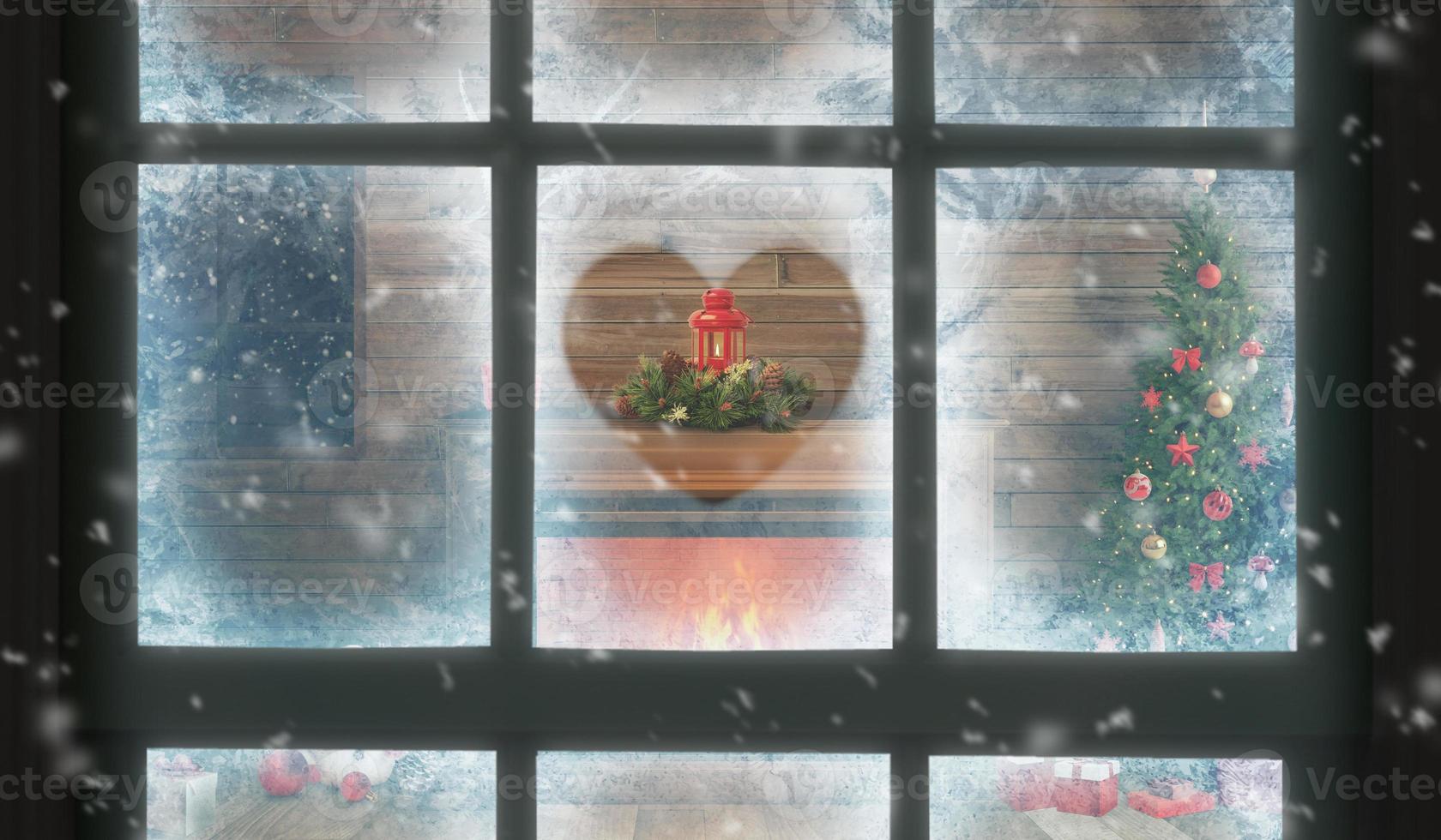 ver a través de la ventana del interior de la casa en Navidad. un corazón pintado en la escarcha de la ventana. dentro hay una chimenea con un árbol de navidad, regalos y decoraciones foto