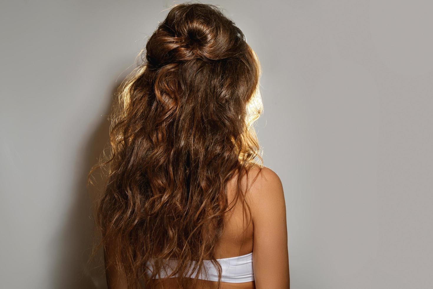 Woman with a beautiful, healthy curly hair photo