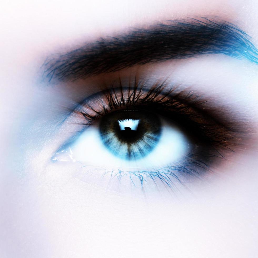 Female eye with interesting effect of motion or light rays photo