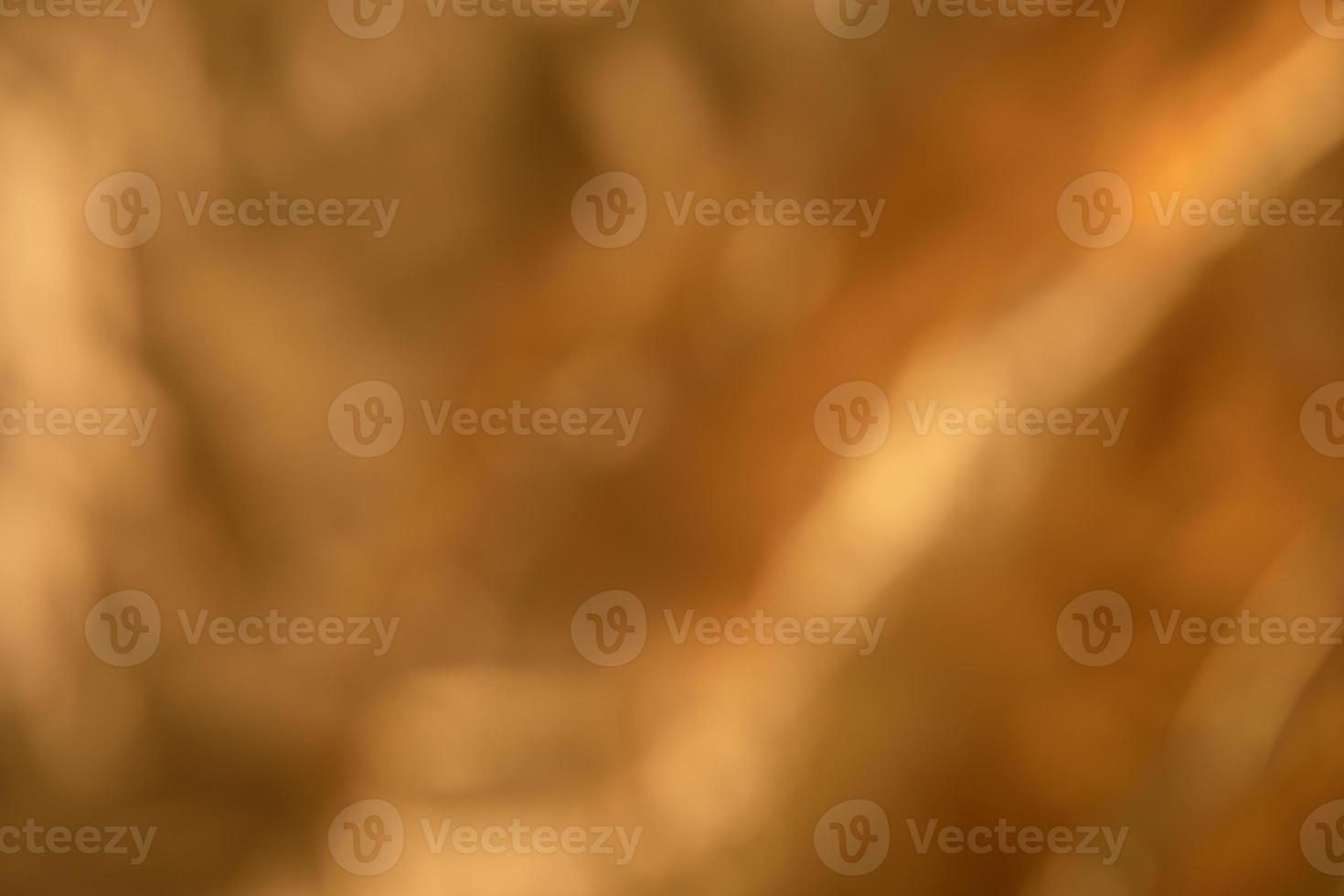 Abstract out of focus golden metallic background photo