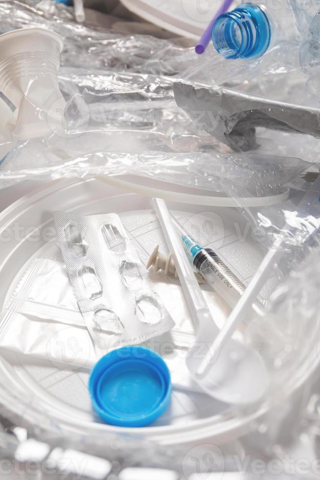 Background with a piile of different plastic waste photo