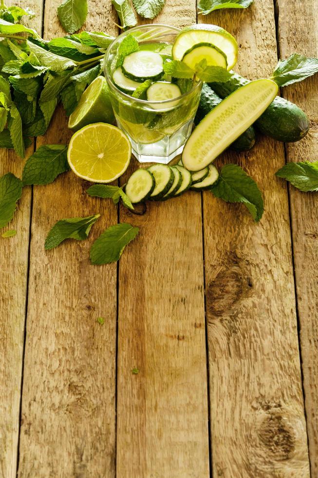 Refreshing drink with cucumber, lime and mint photo