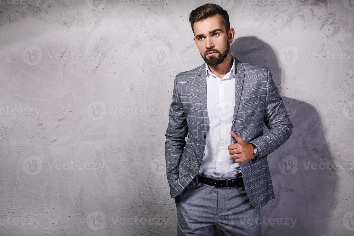 Handsome and bearded man wearing gray suit photo