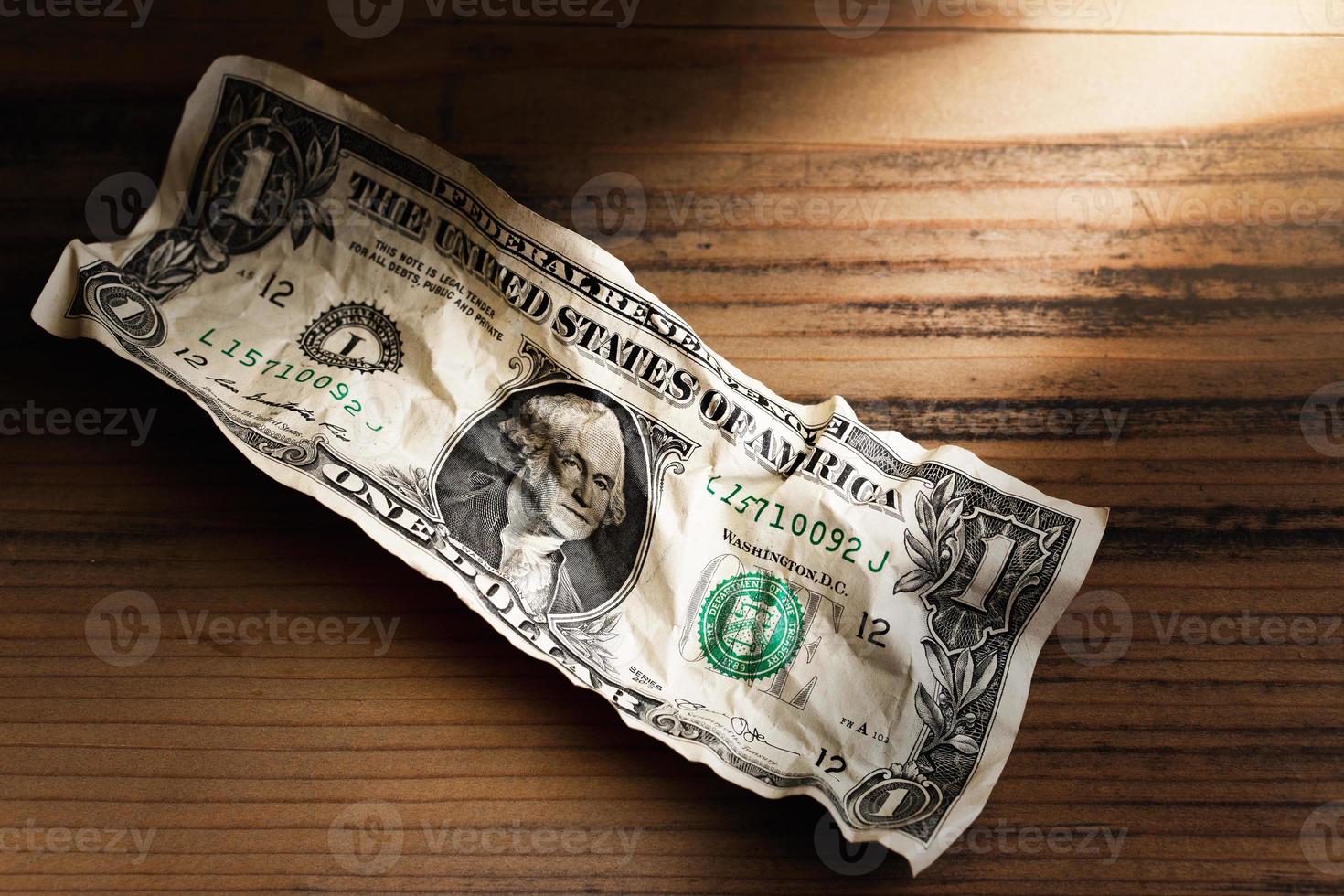 Closeup shot of an old crumpled one dollar bill. photo