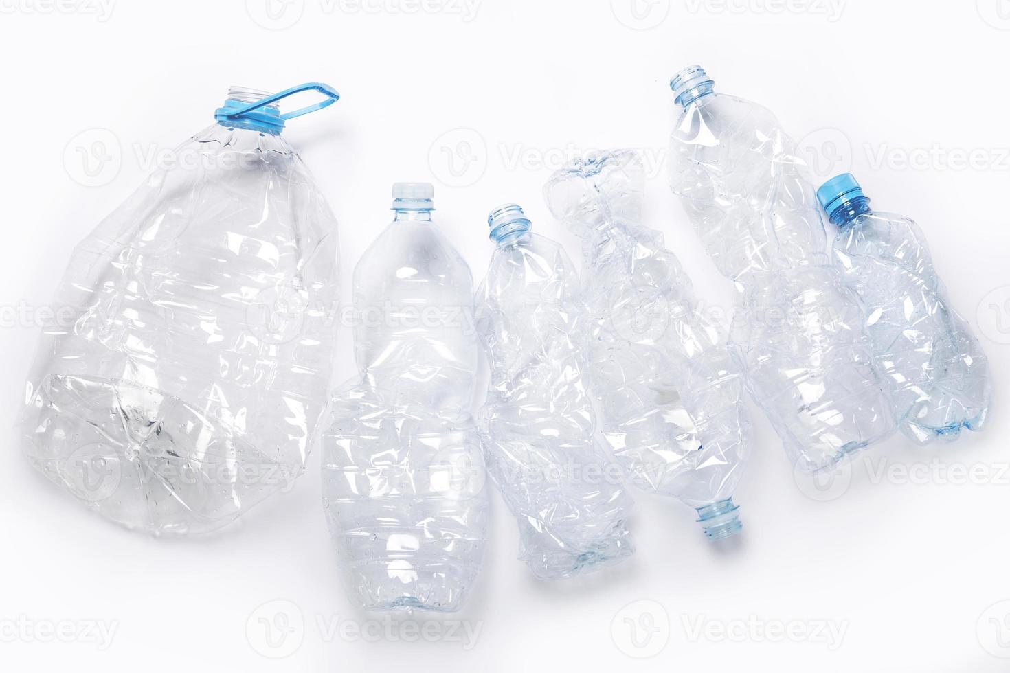 Concepts of pollution and recycling. Different used plastic bottles photo